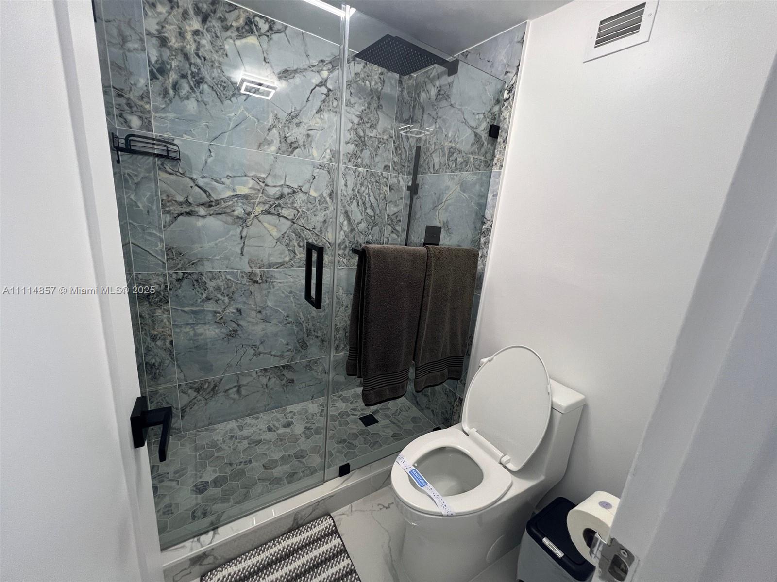100 Lincoln Road, Unit 1207 Miami Beach, FL 33139 - Photo 10 of 54 a bathroom with a toilet and a shower