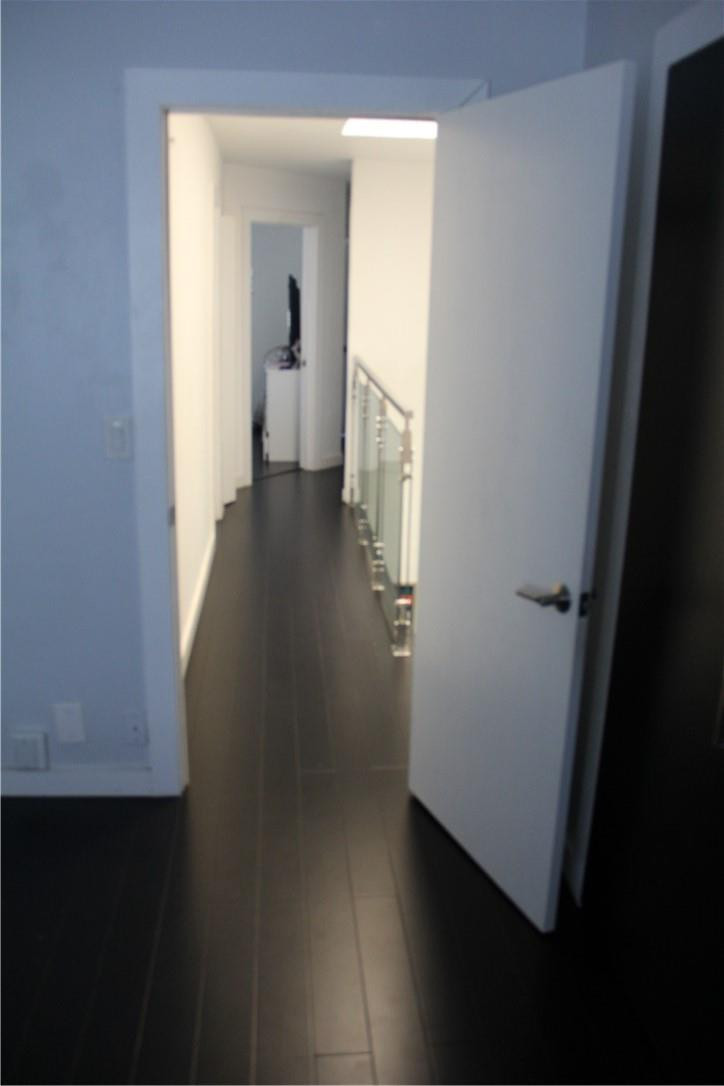 10932 West Sample Road, Unit F2 Coral Springs, FL 33065 - Photo 12 of 23 a view of a hallway with wooden floor and closet