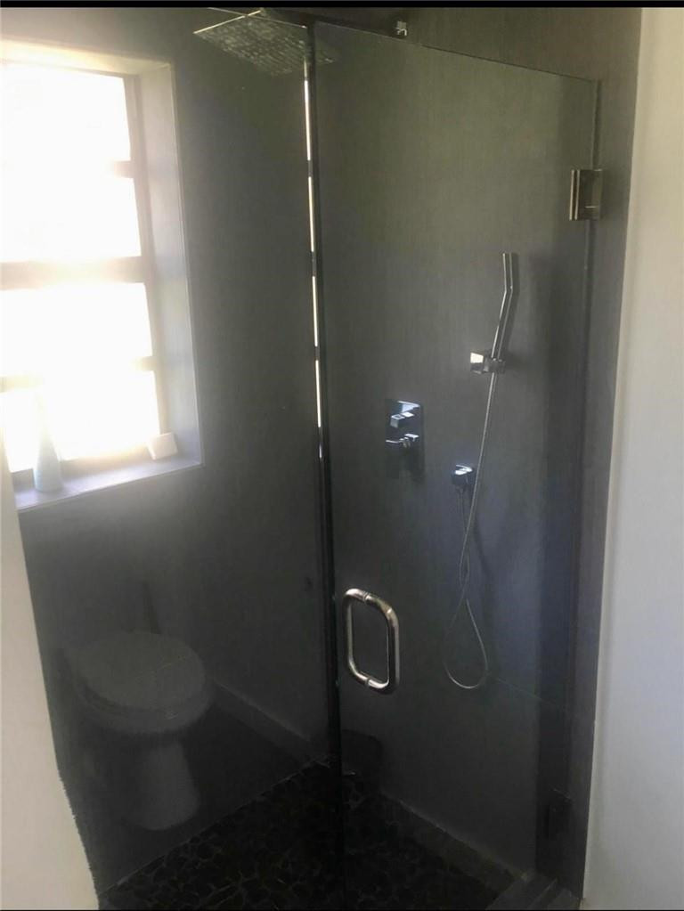 10932 West Sample Road, Unit F2 Coral Springs, FL 33065 - Photo 15 of 23 a bathroom with a shower