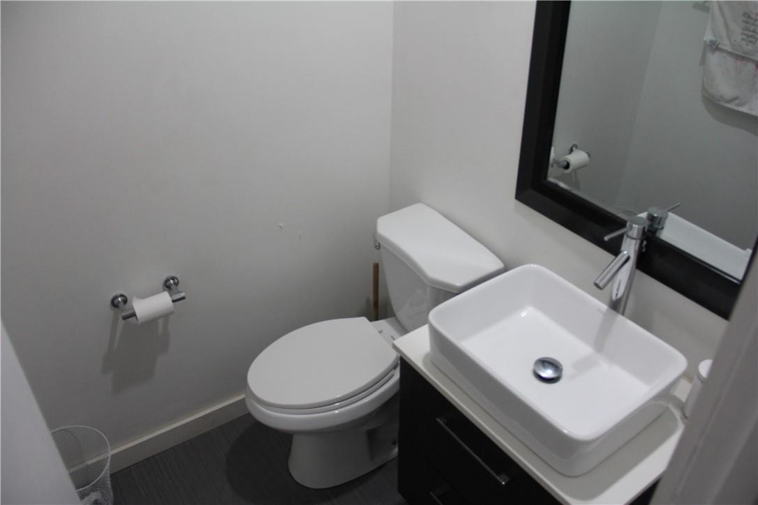 10932 West Sample Road, Unit F2 Coral Springs, FL 33065 - Photo 17 of 23 a white toilet sitting next to a white sink