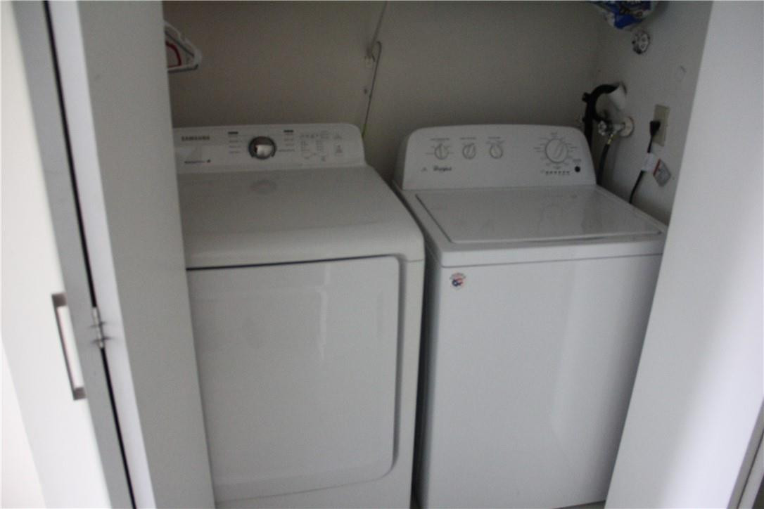 10932 West Sample Road, Unit F2 Coral Springs, FL 33065 - Photo 20 of 23 a utility room with dryer and washer