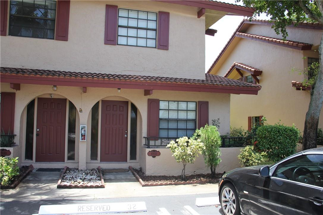 10932 West Sample Road, Unit F2 Coral Springs, FL 33065 - Photo 2 of 23 a front view of a house