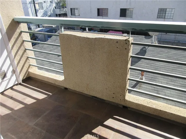 a view of washer and dryer with wooden floor