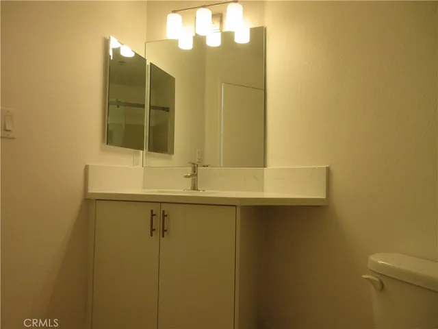 a bathroom with a sink and mirror