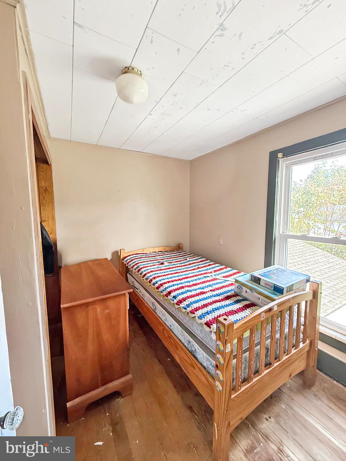 86 Lynn Street Madera, PA 16661 - Photo 13 of 13 a bedroom with a bed and a dresser