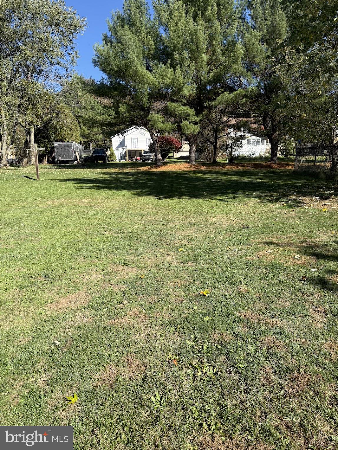 86 Lynn Street Madera, PA 16661 - Photo 3 of 13 a view of a swimming pool and trees in the background