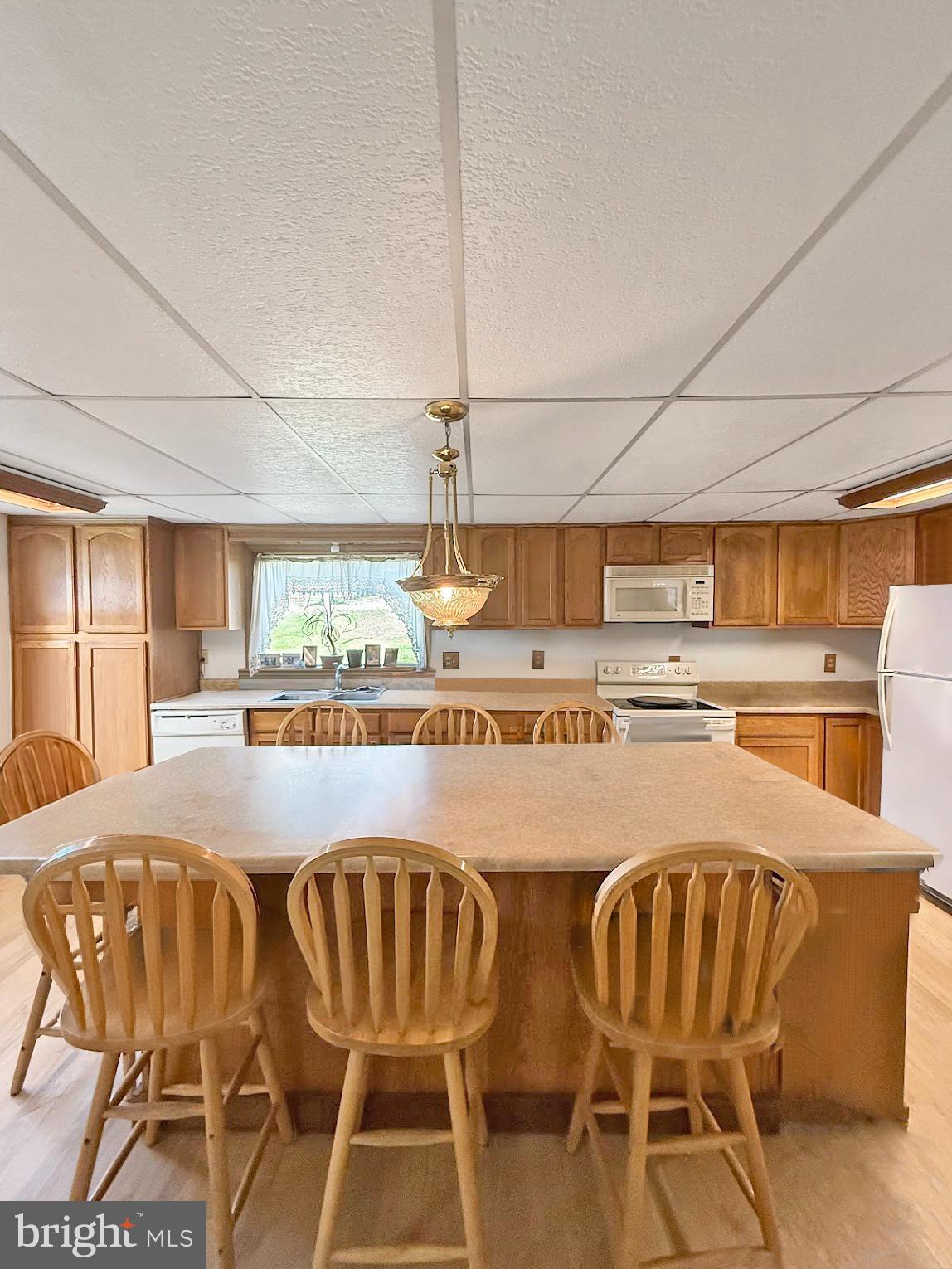 86 Lynn Street Madera, PA 16661 - Photo 4 of 13 a view of a kitchen with dining area windows and kitchen view