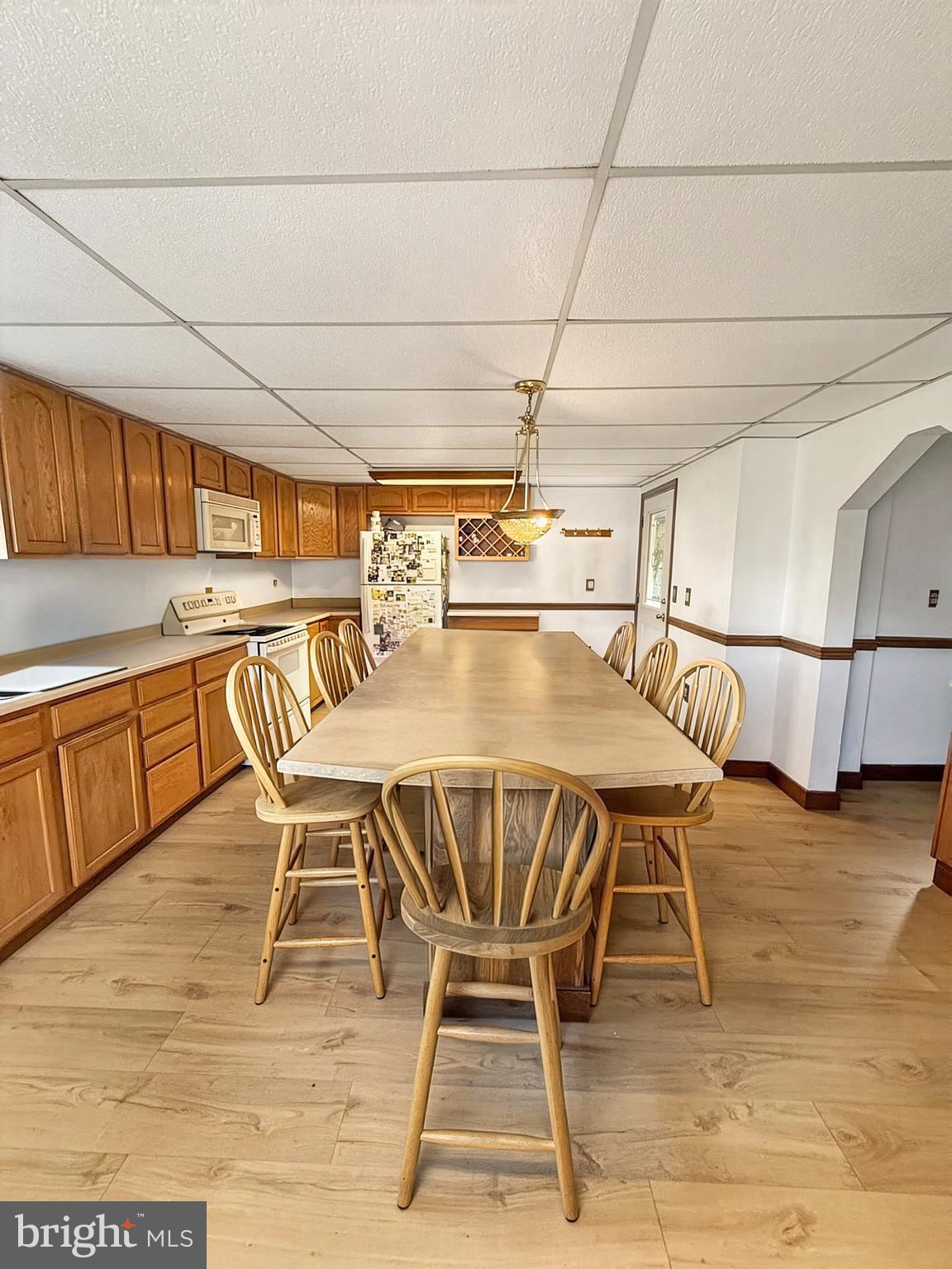 86 Lynn Street Madera, PA 16661 - Photo 5 of 13 a dining area with stainless steel appliances granite countertop a table chairs and granite counter tops