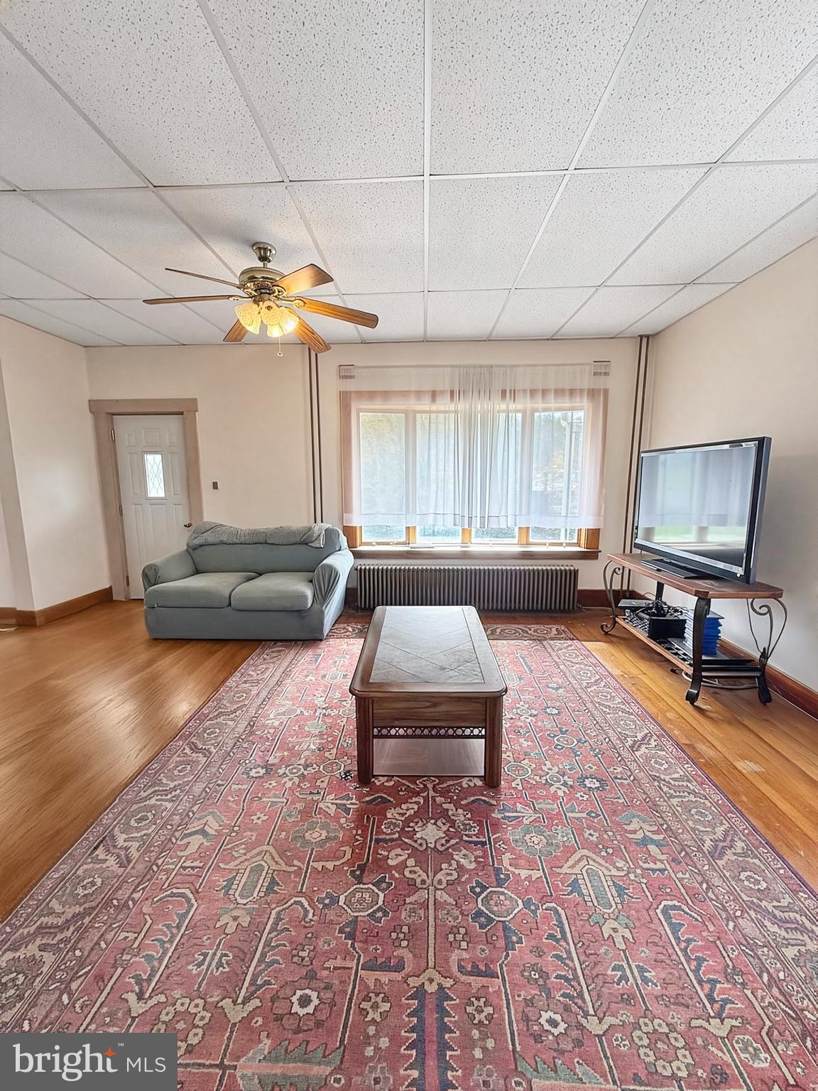 86 Lynn Street Madera, PA 16661 - Photo 7 of 13 a living room with furniture and a chandelier