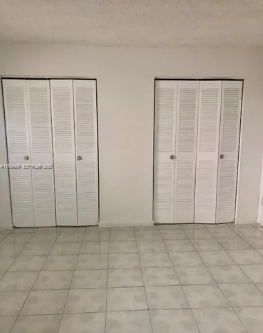 a view of entryway with white walls