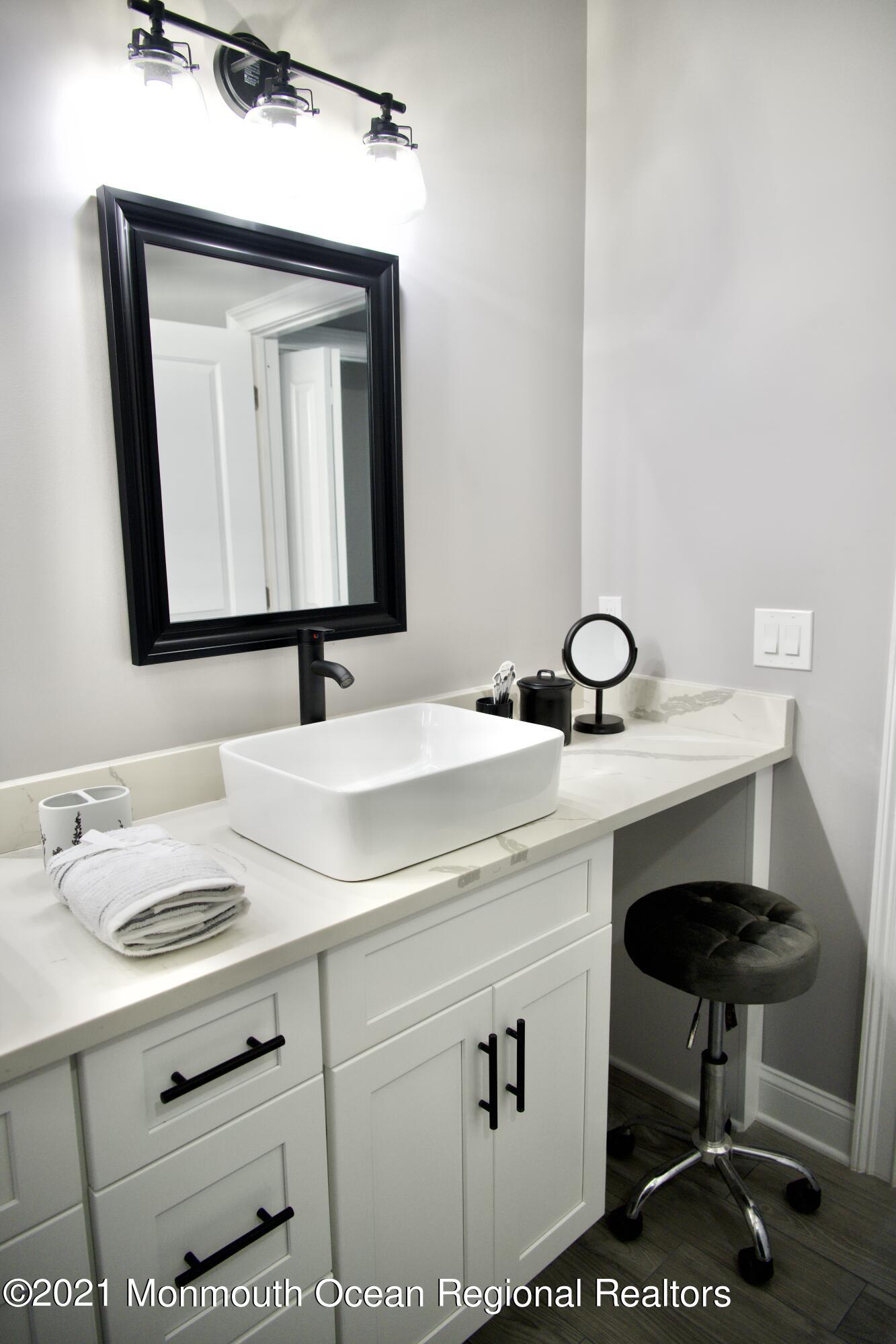 2230 Rogers Road Point Pleasant, NJ 08742 - Photo 40 of 51 a bathroom with a sink and a mirror