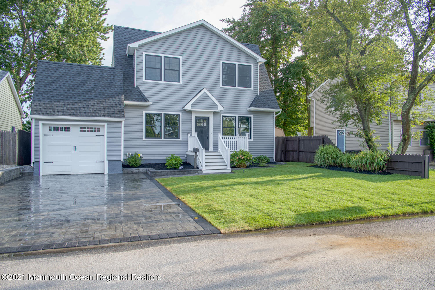 2230 Rogers Road Point Pleasant, NJ 08742 - Photo 50 of 51 a front view of a house with a yard and garage
