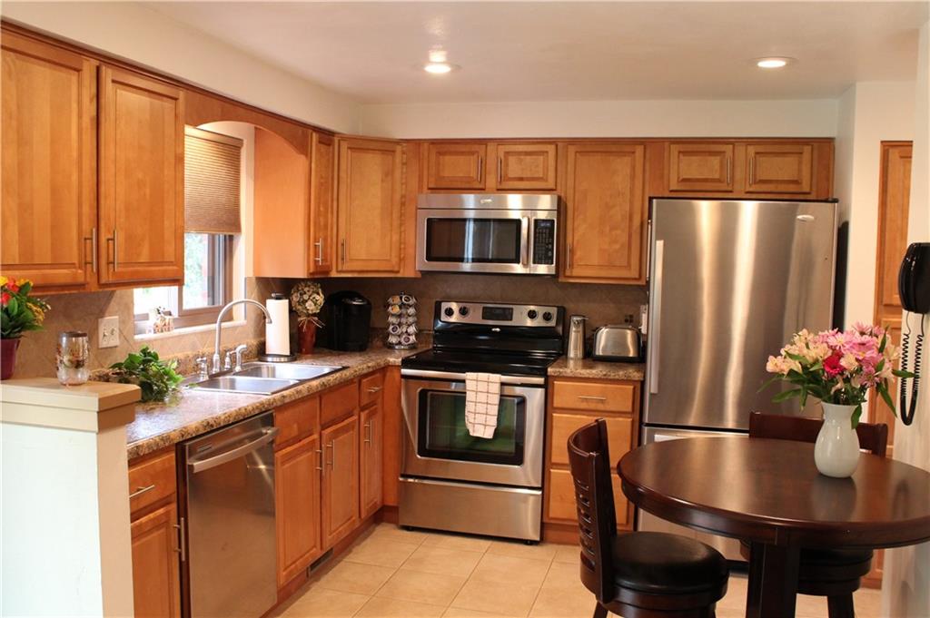 Your dream kitchen has all stainless steel appliances, new cabinetry, flooring, window treatments.  All appliances stay with home.  Recessed lighting as well as window and sliding glass door makes this kitchen a place to enjoy all year round.