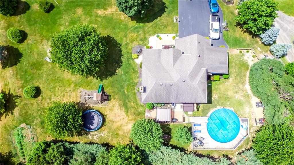 106 East Brewster Road Butler, PA 16001 - Photo 24 of 25 The Side Yard Boasts a Level Yard, Fire Pit Area, & Play Set