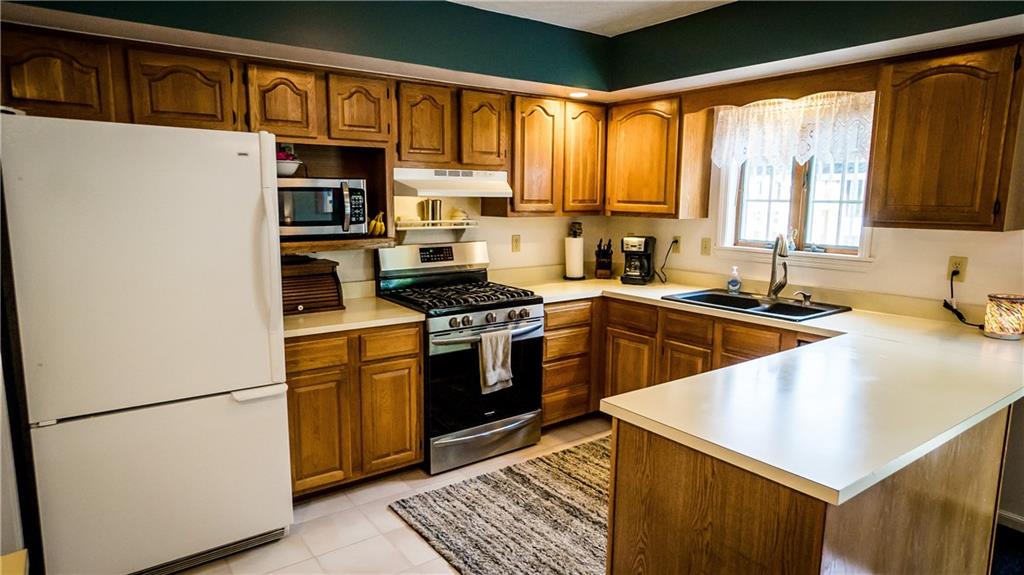 106 East Brewster Road Butler, PA 16001 - Photo 6 of 25 20x13 Kitchen with Ample Counter Space and Cabinetry