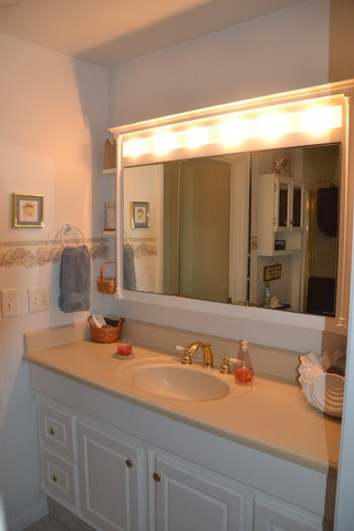 636 Reynoldswood Road Dixon, IL 61021 - Photo 15 of 25 a bathroom with a sink and a mirror