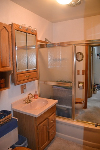 636 Reynoldswood Road Dixon, IL 61021 - Photo 19 of 25 a bathroom with a sink and mirror