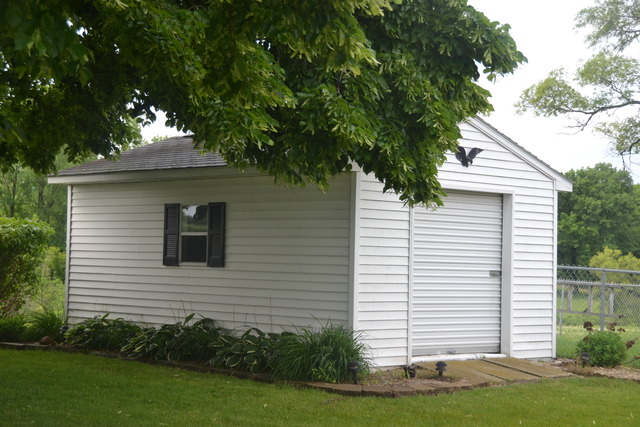 636 Reynoldswood Road Dixon, IL 61021 - Photo 21 of 25 a front view of a house with a garden