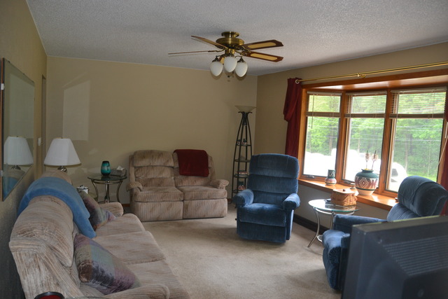 636 Reynoldswood Road Dixon, IL 61021 - Photo 8 of 25 a living room with furniture and a large window