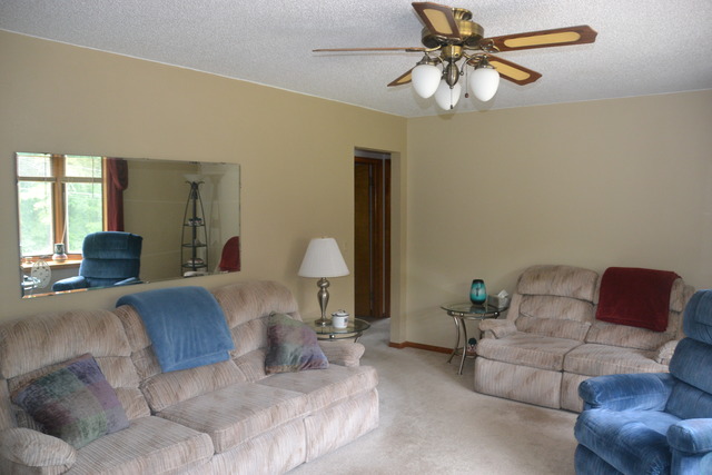 636 Reynoldswood Road Dixon, IL 61021 - Photo 9 of 25 a living room with furniture and a chandelier