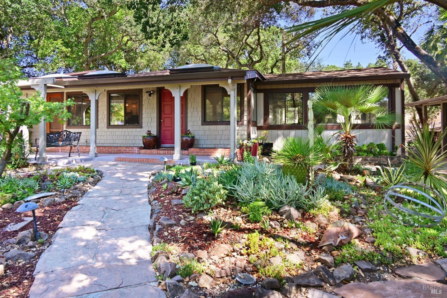 a front view of a house with garden