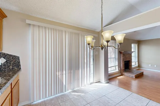 a view of a living room and a balcony