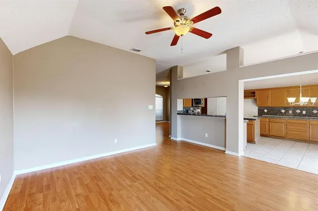 a view of a kitchen with a sink and a stove top oven
