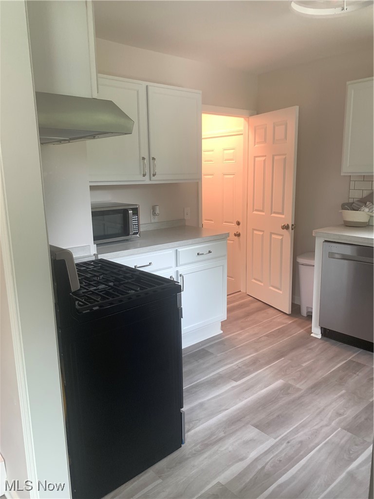 1714 Woods Road Akron, OH 44306 - Photo 12 of 28 New gas oven, brand new dishwasher & refrigerator
