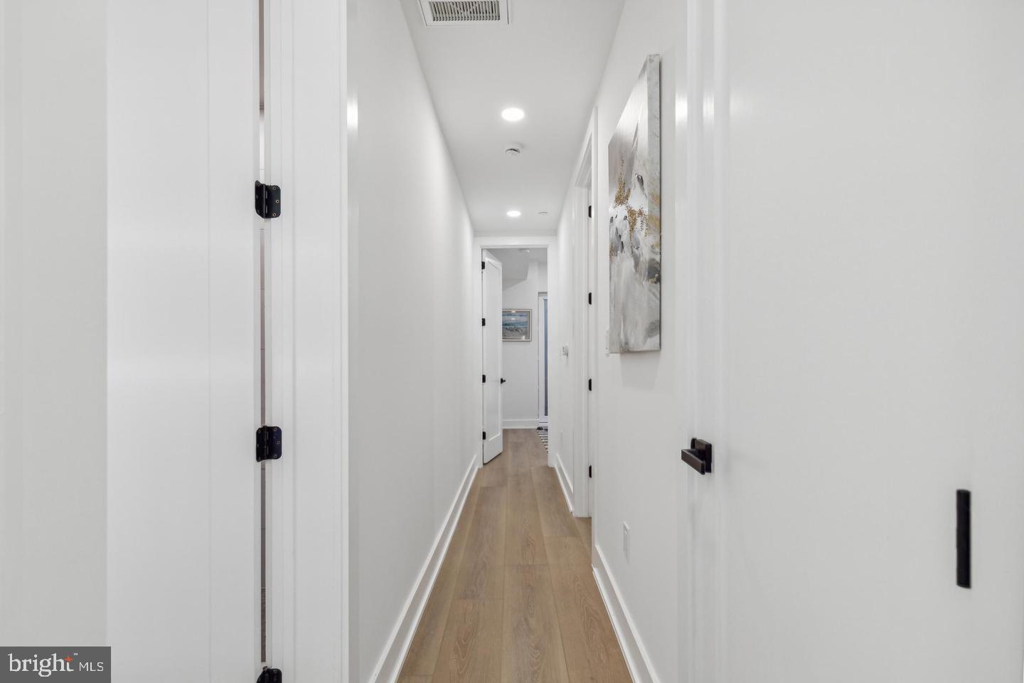 705 Quincy Street Northeast, Unit 2 Washington, DC 20017 - Photo 10 of 15 a view of a hallway with wooden floor