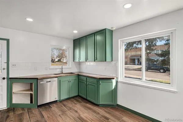 a kitchen with a sink and wooden cabinets