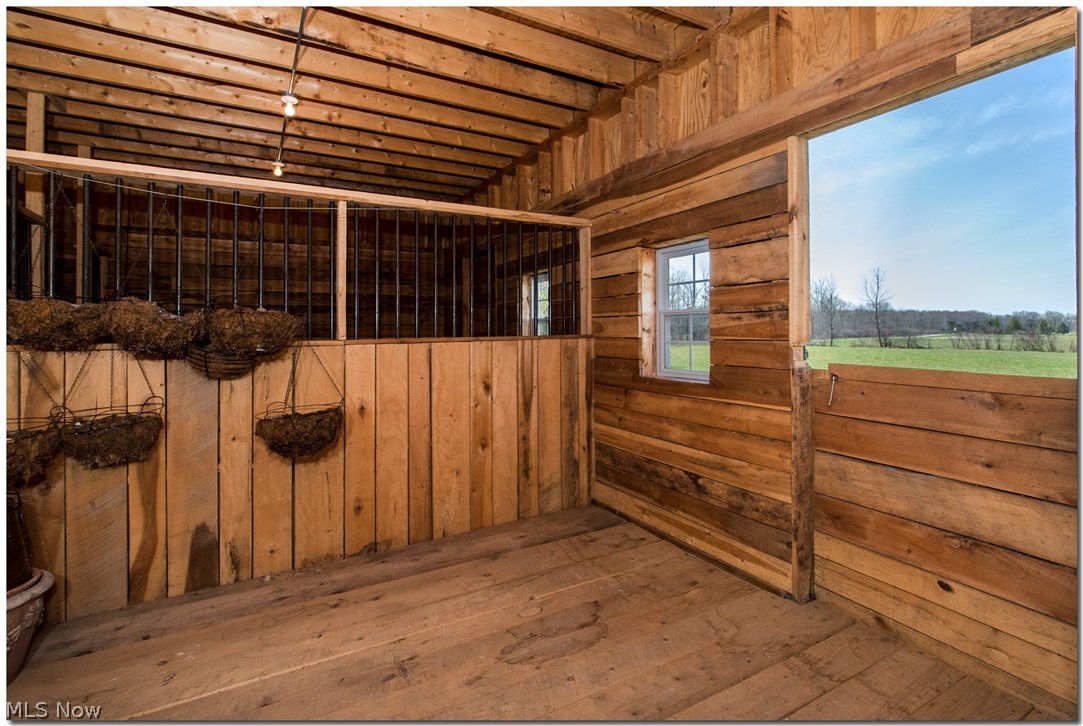 17580 Huntley Road Windsor, OH 44099 - Photo 28 of 35 One of 2 large stalls--never used for animals. Still like new. So much more on first level--dutch doors to potting room. Sliding barn door separating barn area from workspace/garage area. Sliding barn door to wine making room. And large sliding barn door to outside to bring lawn equipment in and out