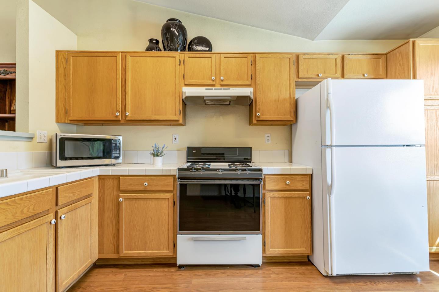 440 Meyer Circle Gonzales, CA 93926 - Photo 15 of 45 a kitchen with a refrigerator and a sink