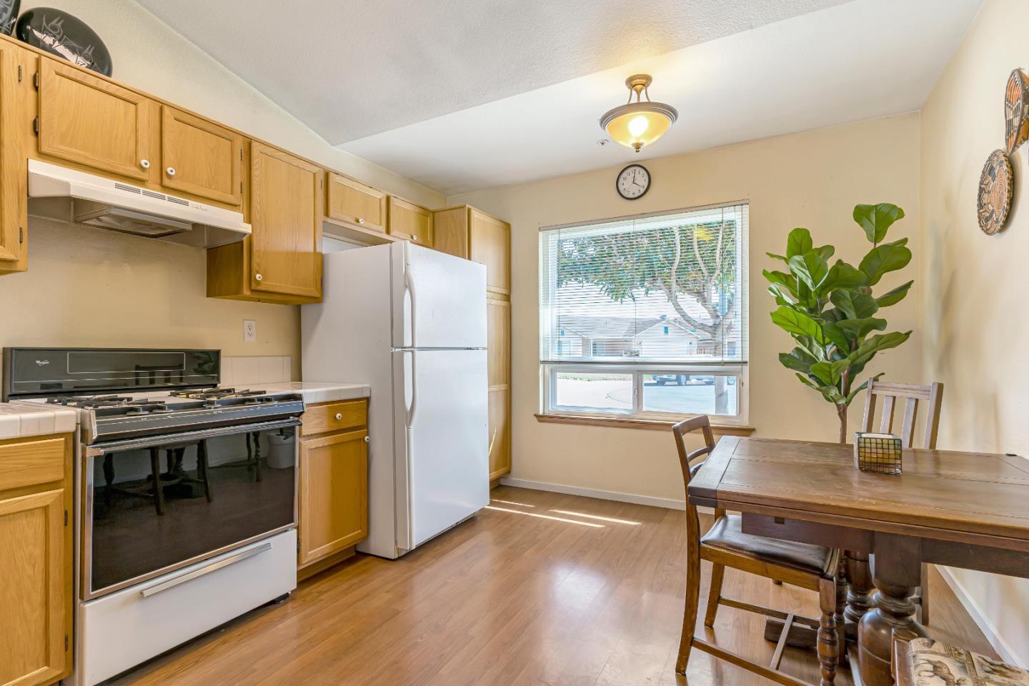 440 Meyer Circle Gonzales, CA 93926 - Photo 16 of 45 a kitchen with appliances a counter space and wooden floor