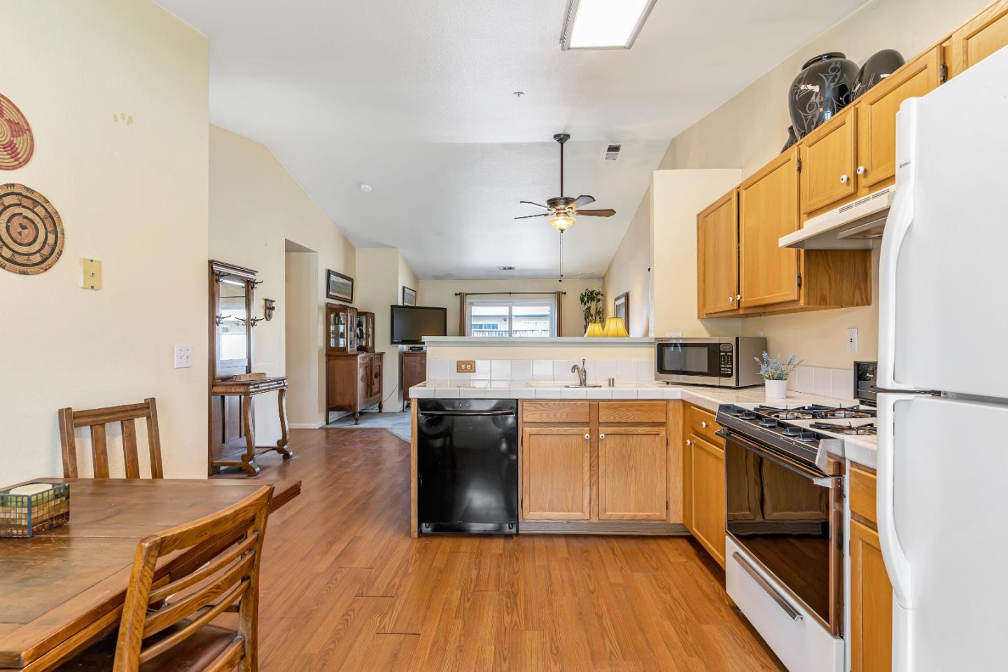 440 Meyer Circle Gonzales, CA 93926 - Photo 18 of 45 a kitchen with a sink a counter top space and stainless steel appliances