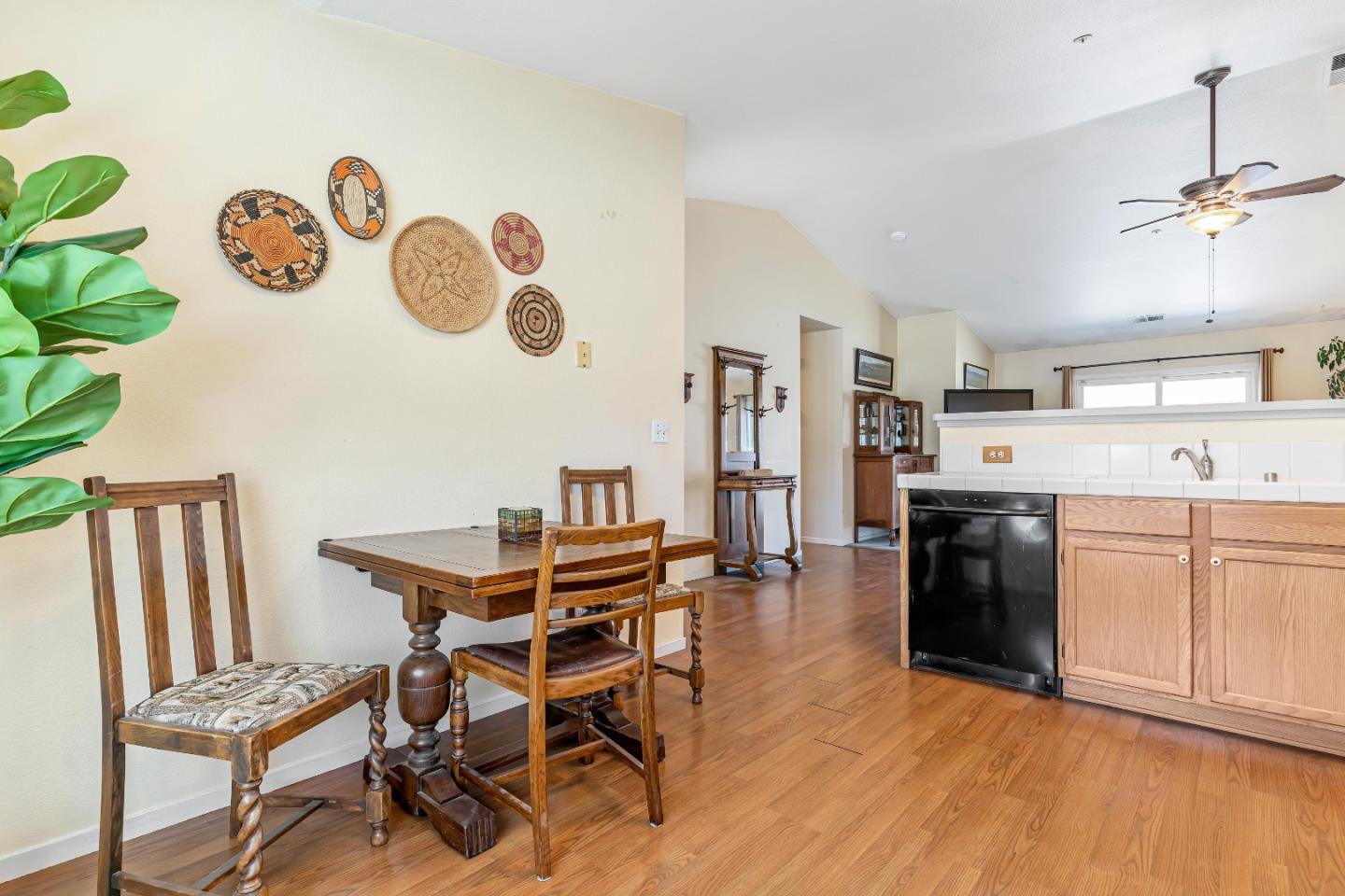 440 Meyer Circle Gonzales, CA 93926 - Photo 20 of 45 a dining room with kitchen island stainless steel appliances furniture a refrigerator and a window