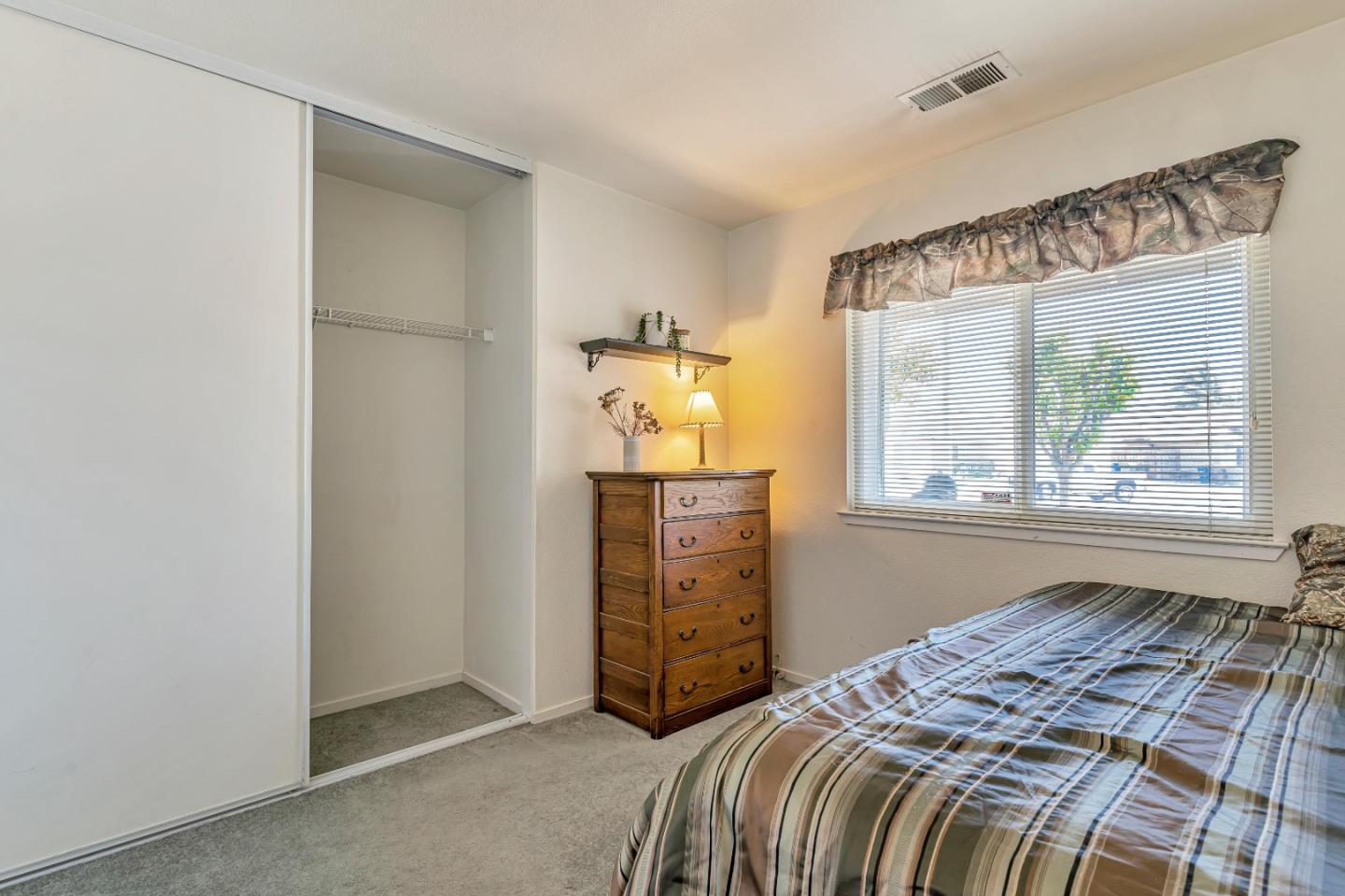 440 Meyer Circle Gonzales, CA 93926 - Photo 25 of 45 a bedroom with a bed and a window
