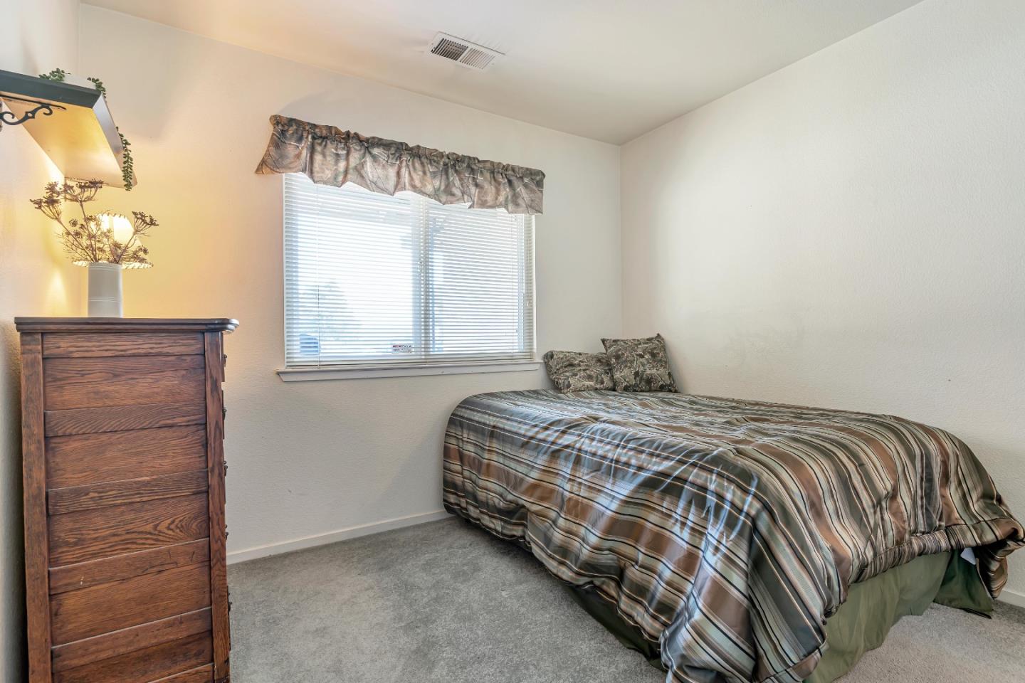 440 Meyer Circle Gonzales, CA 93926 - Photo 26 of 45 a bedroom with a bed and a window