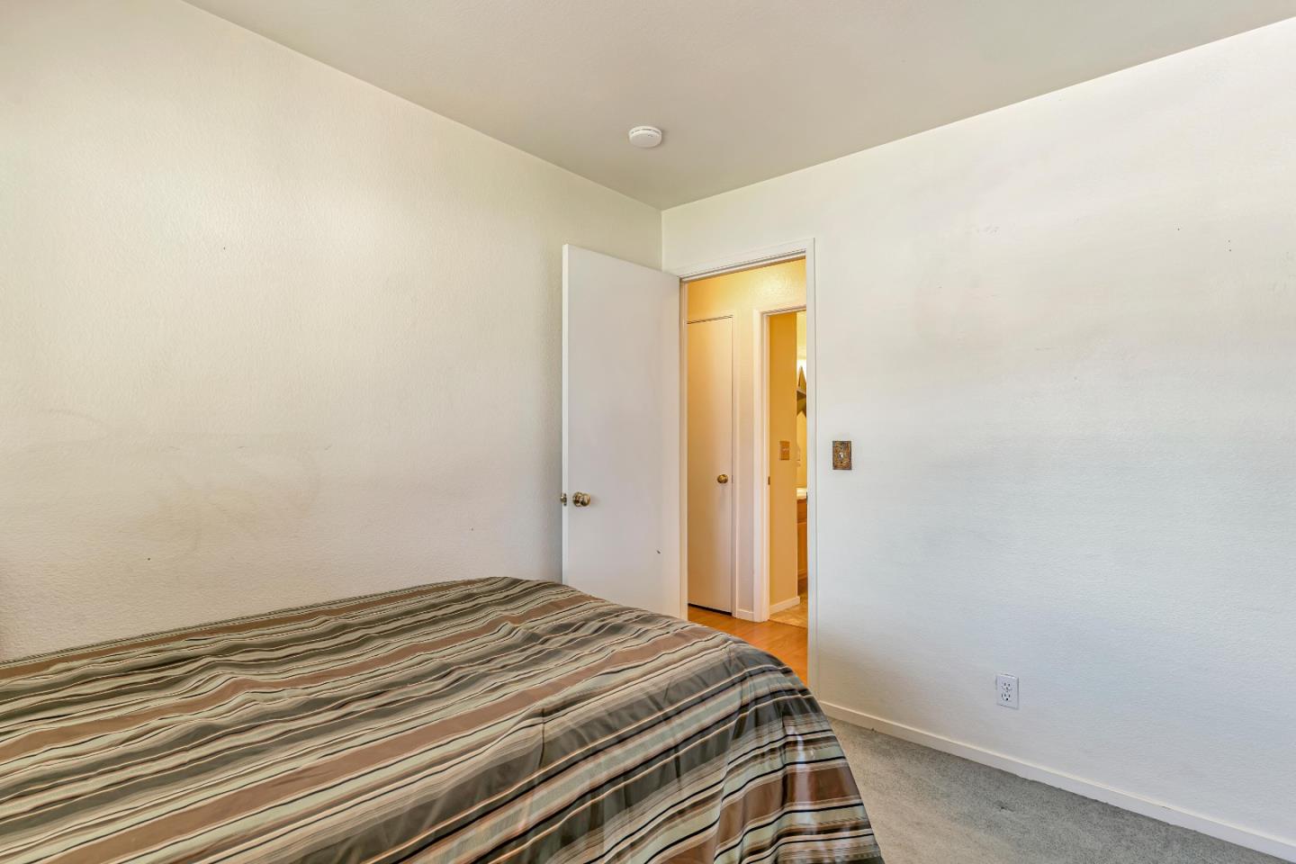 440 Meyer Circle Gonzales, CA 93926 - Photo 28 of 45 a bedroom with a bed and wooden floor