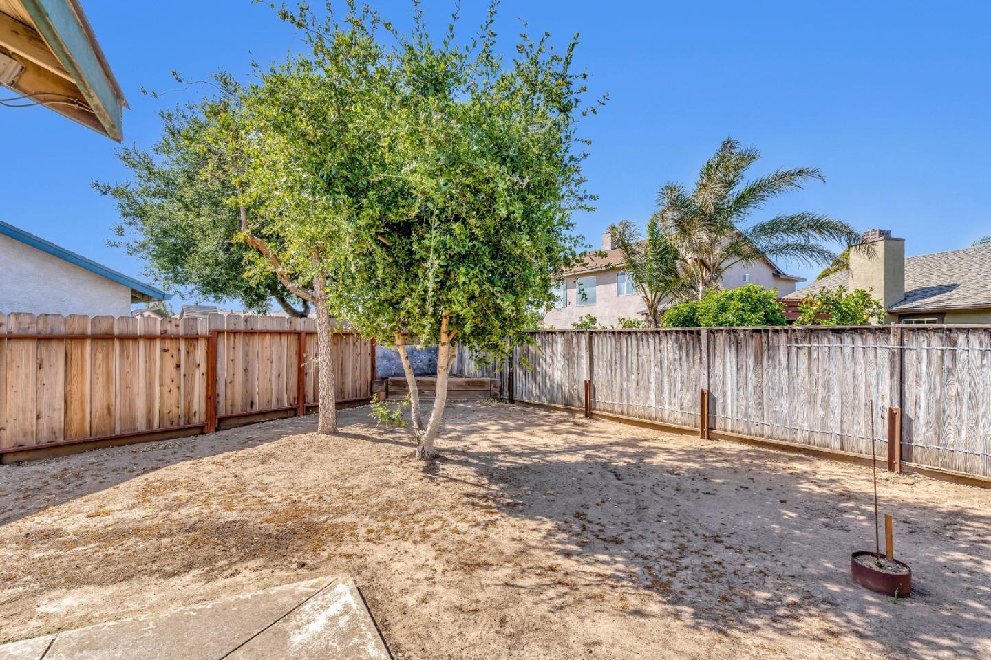 440 Meyer Circle Gonzales, CA 93926 - Photo 40 of 45 a backyard of a house with plants and wooden fence