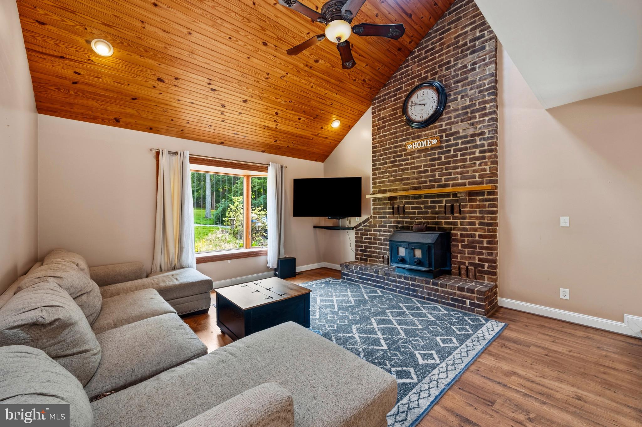 2702 Bird View Road Westminster, MD 21157 - Photo 6 of 41 a living room with furniture and a fireplace
