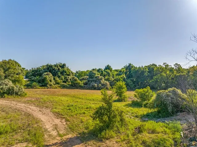 a view of a yard with an outdoor space and seating area