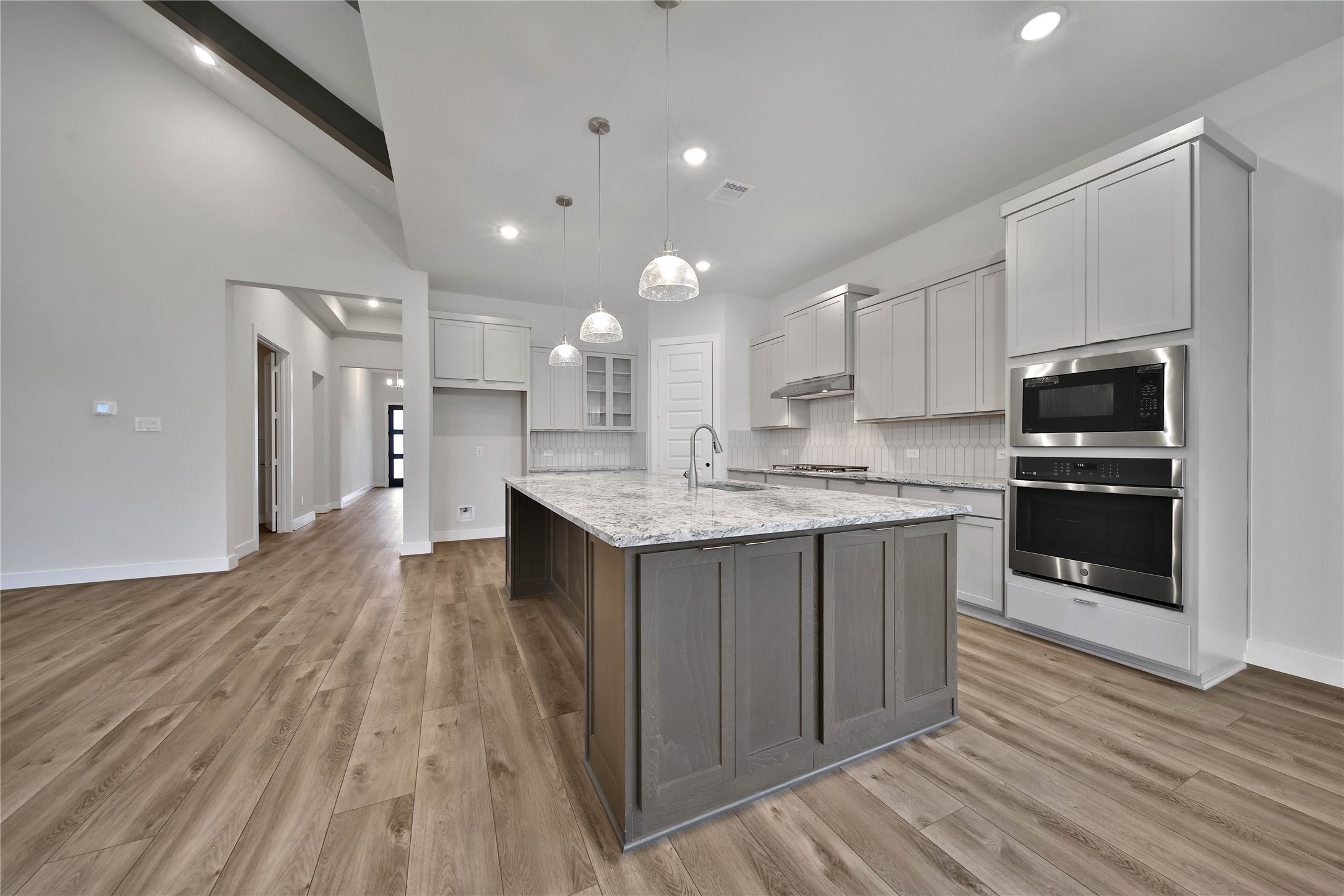 4602 Magnolia Bend Drive Rosharon, TX 77583 - Photo 7 of 39 a kitchen with kitchen island granite countertop a sink cabinets and stainless steel appliances