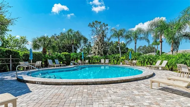 a view of a swimming pool with a patio