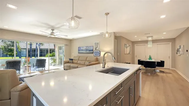 a view of kitchen and dining area with a large window