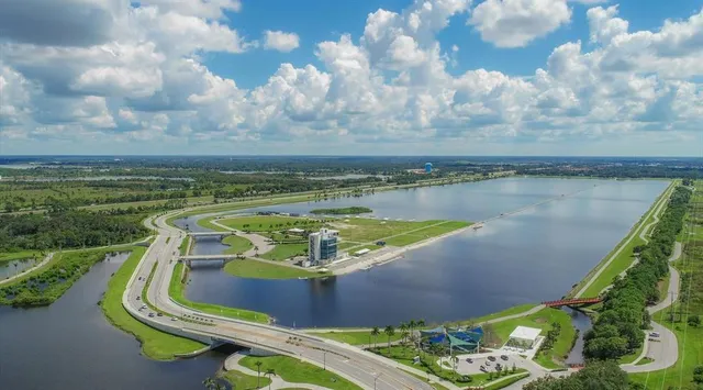 a view of a bench in middle of the road