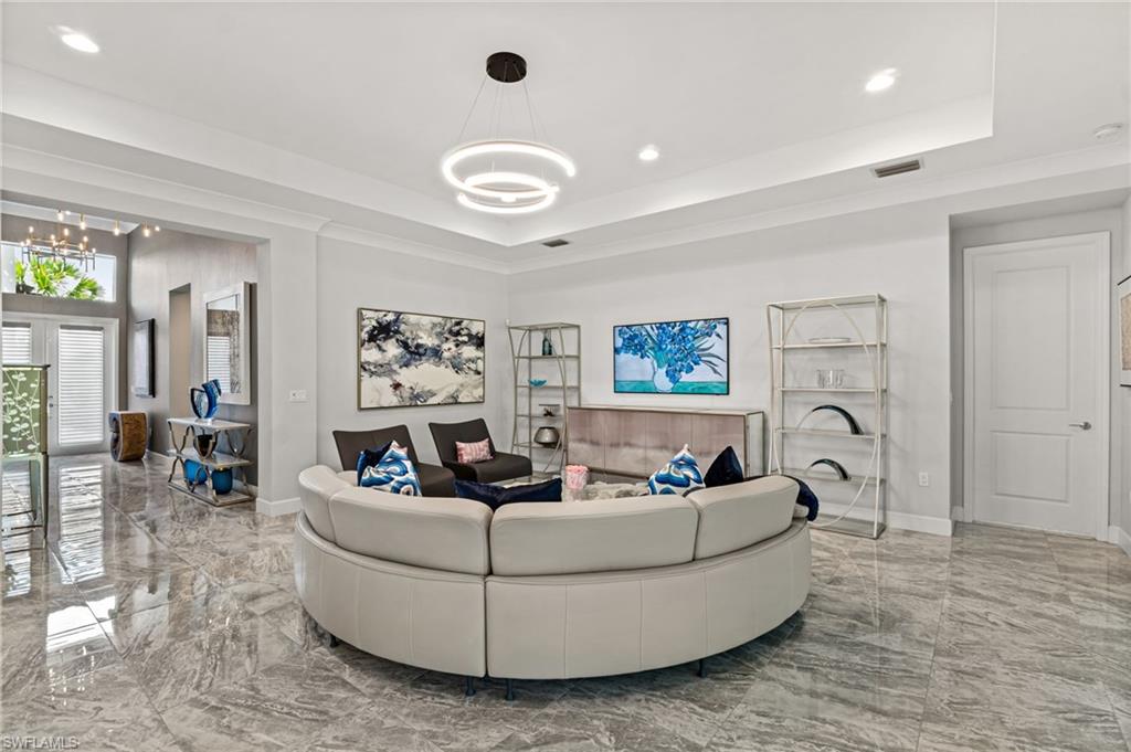 12033 Azalea Way Naples, FL 34120 - Photo 11 of 46 Polished porcelain flooring throughout the home.
