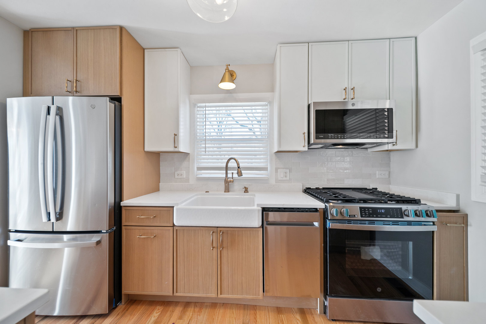 1601 Fowler Avenue Evanston, IL 60201 - Photo 11 of 33 a kitchen with stainless steel appliances a stove microwave and refrigerator