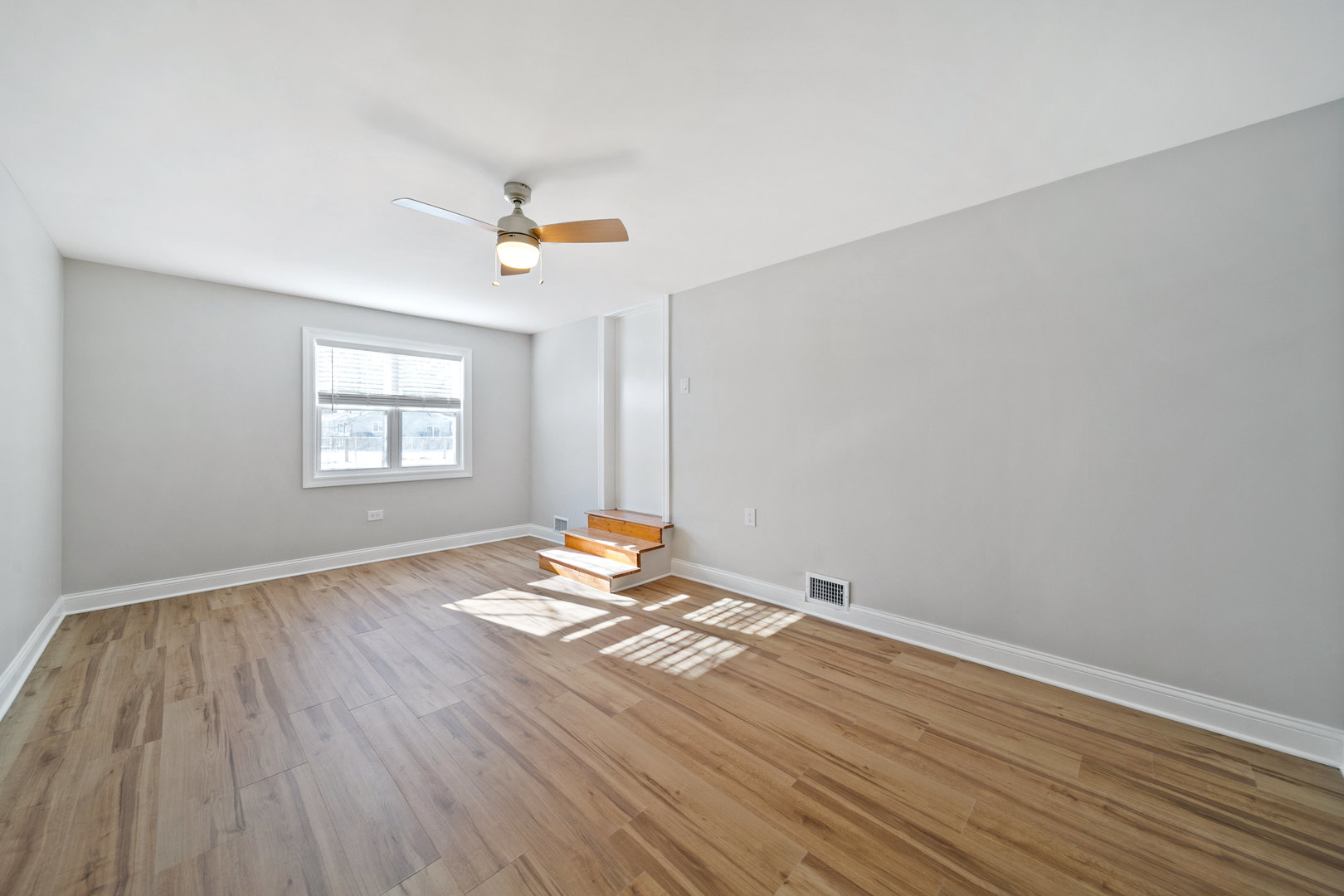 1601 Fowler Avenue Evanston, IL 60201 - Photo 15 of 33 wooden floor in an empty room with a window