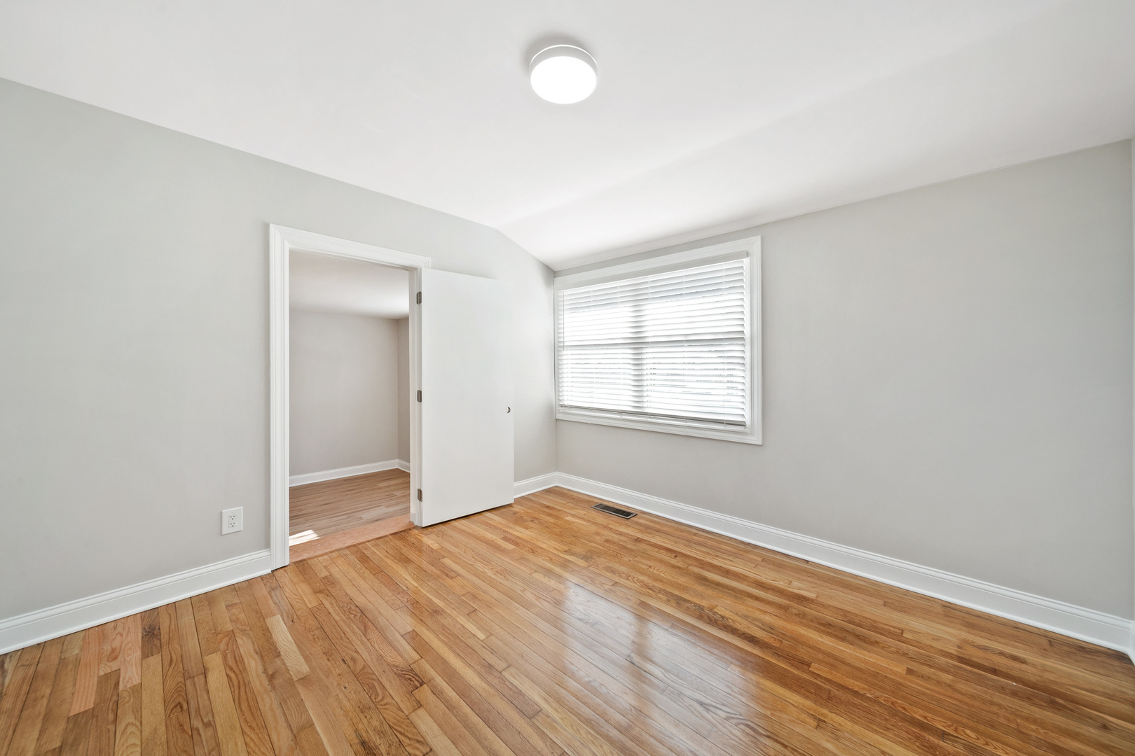 1601 Fowler Avenue Evanston, IL 60201 - Photo 23 of 33 an empty room with wooden floor and windows