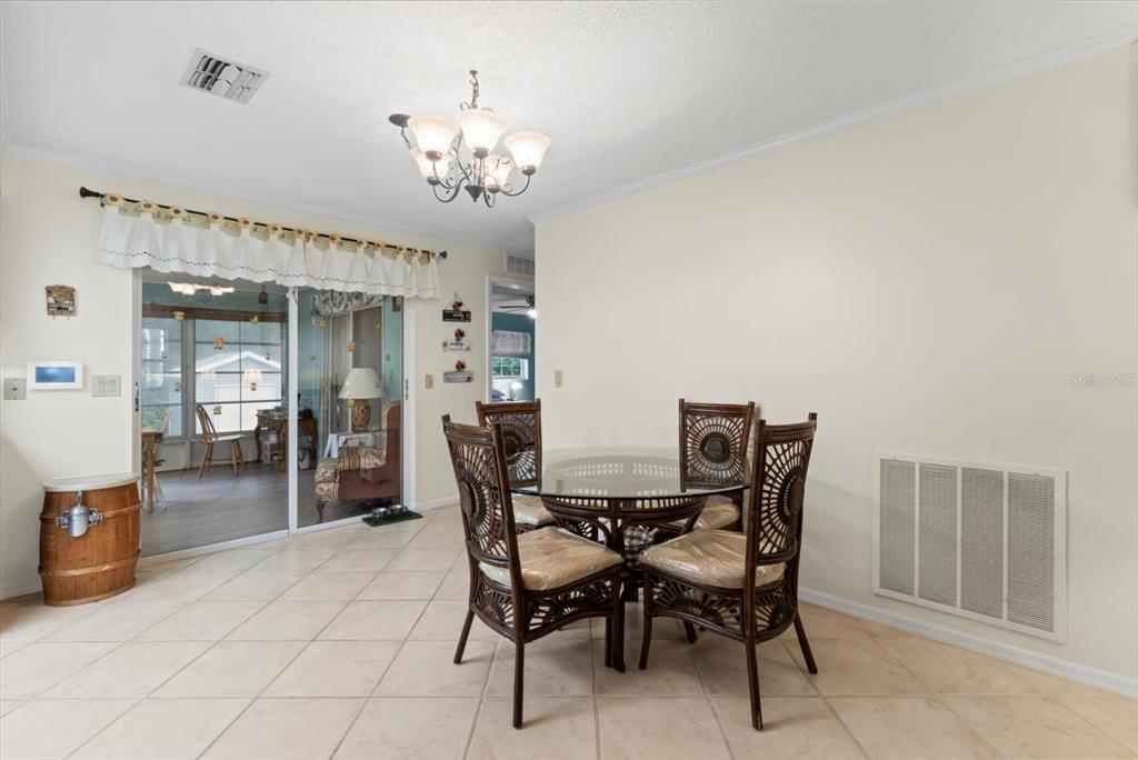 3550 South Dean Terrace Inverness, FL 34452 - Photo 17 of 37 a view of a dining room with furniture and chandelier